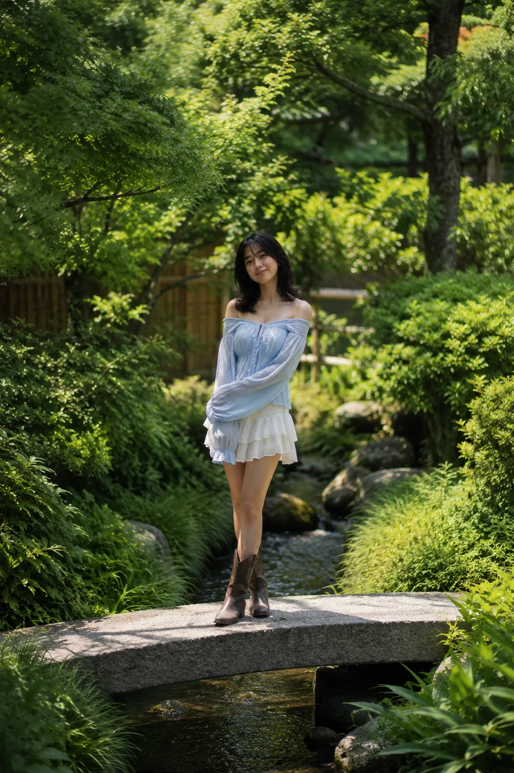 Mitsuki standing on a stone bridge in a green Japanese garden wearing a blue top and white skirt